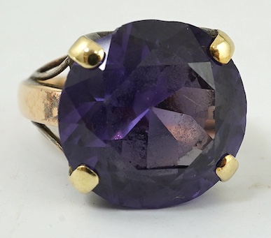 A 14k and single stone round cut synthetic colour change corundum, dress ring, size M, gross weight 7.5 grams. Condition - fair (loose in setting)